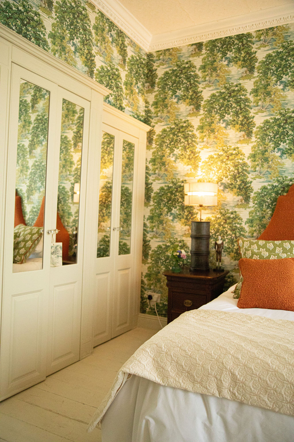 Designer interior of the penthouse apartment — luxury bedding and period furnishings